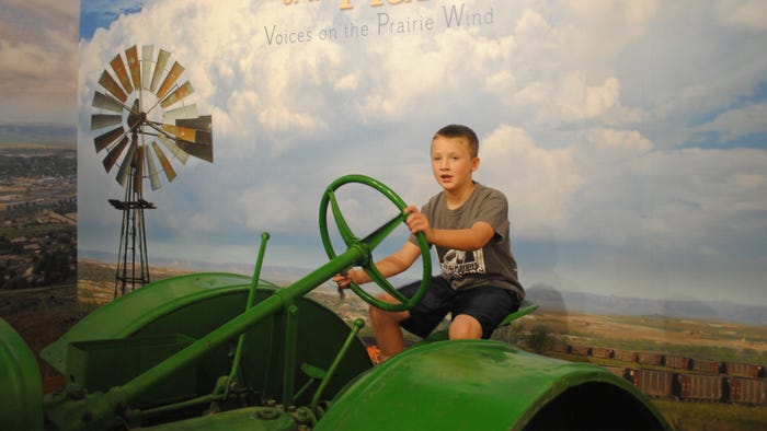 Boy on a tractor at Scotts Bluff National Monument