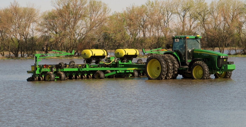 tractor in flooded field