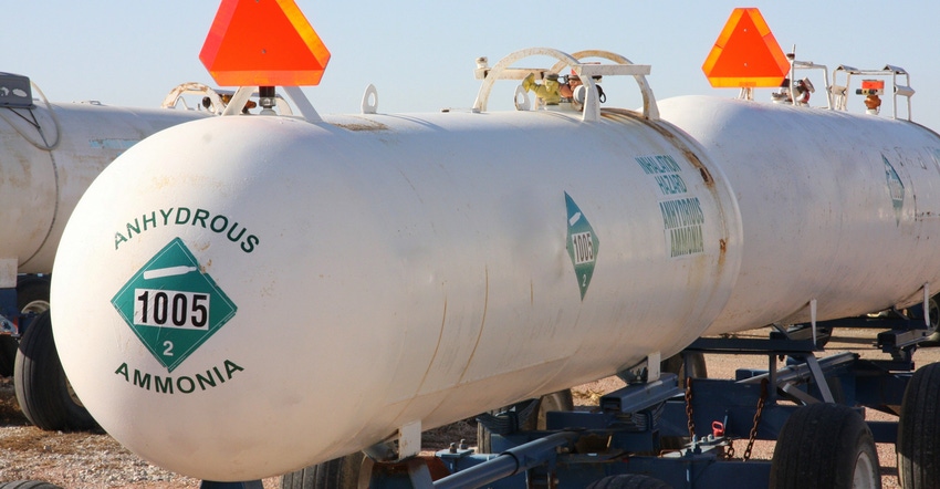 Close up of anhydrous tanks outfitted with slow-moving-vehicle signs
