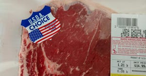 Beef steak packaged with a sticker that reads product of the USA
