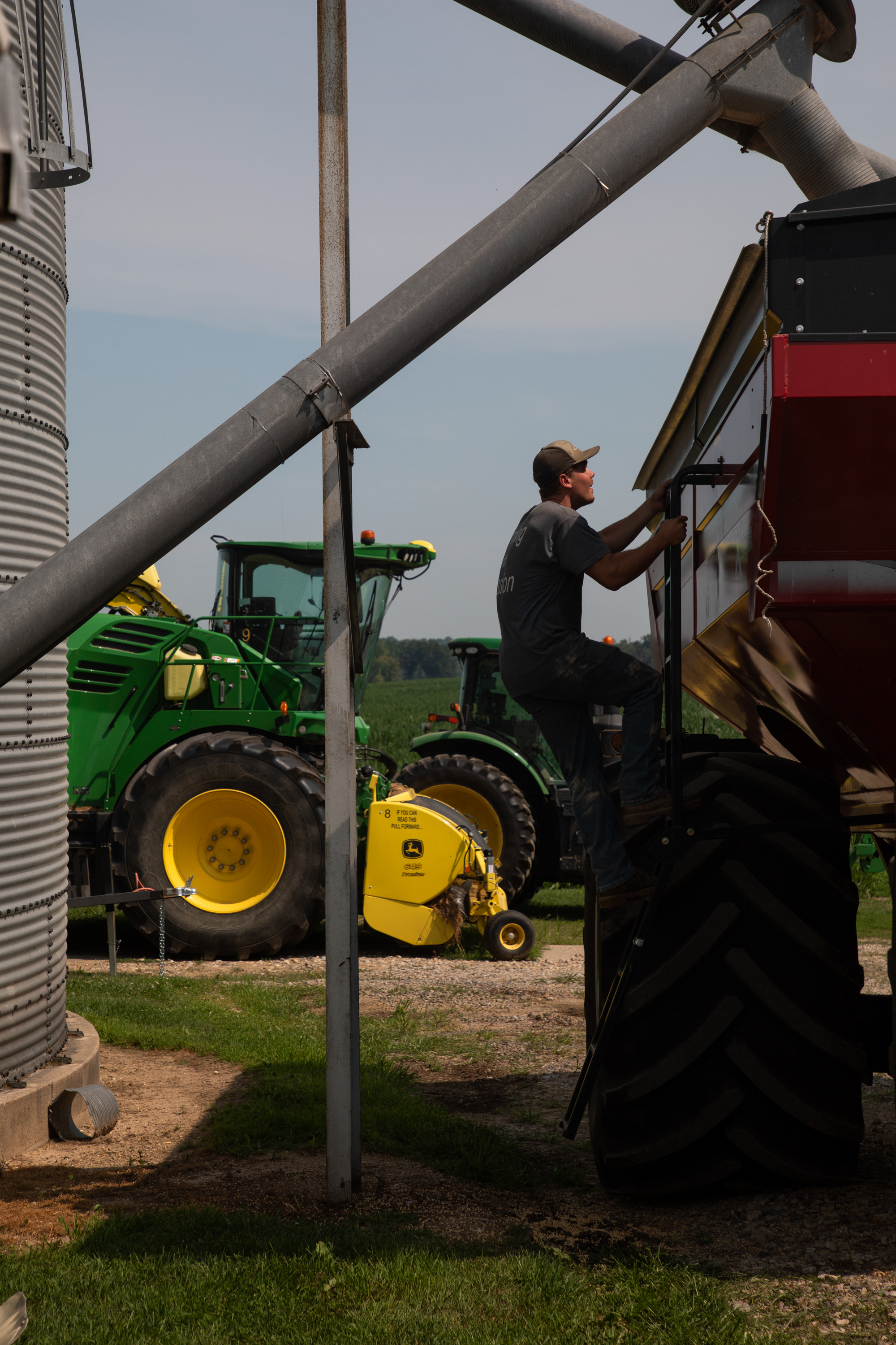Josh Perkins checks the fill height of the soybeans.