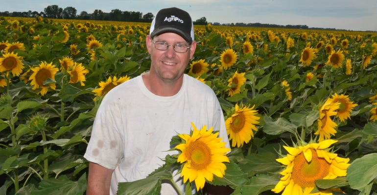 Kevin Capistran in sunflower field