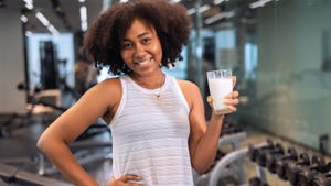 Girl holding a glass of milk