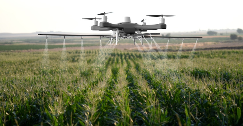 Drone spraying a field