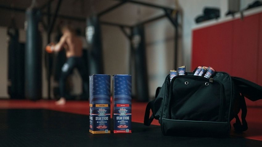 A steak sticks product shot against a background with a man in a boxing gym