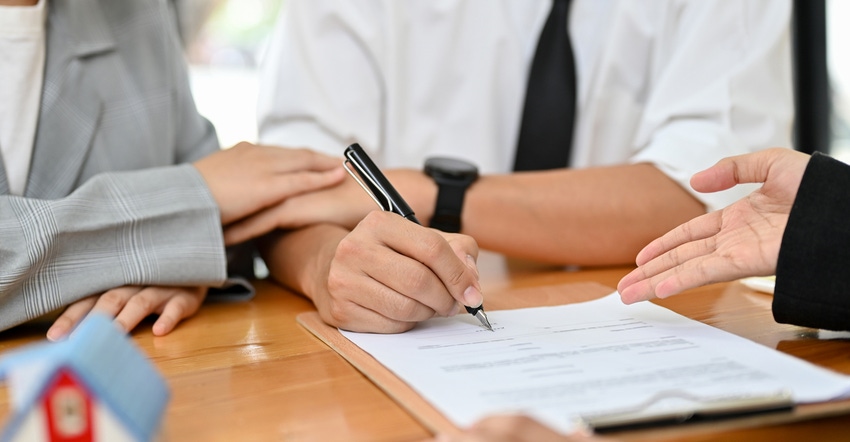 Couple signing contract