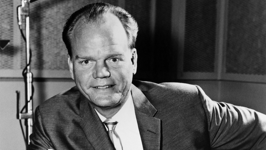 A black and white photograph of broadcaster Paul Harvey