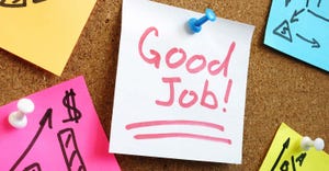 Post-it note pinned to a board saying Good Job!