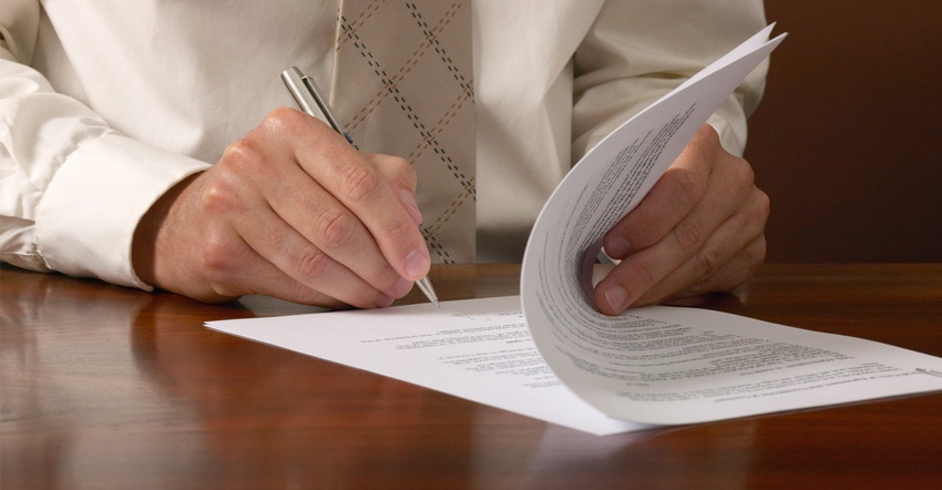 Person signing contract