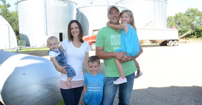 Travis and Andrea Strasser pictured with their 3 children