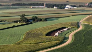 aerial view of cornfields and soybean fields with farms 