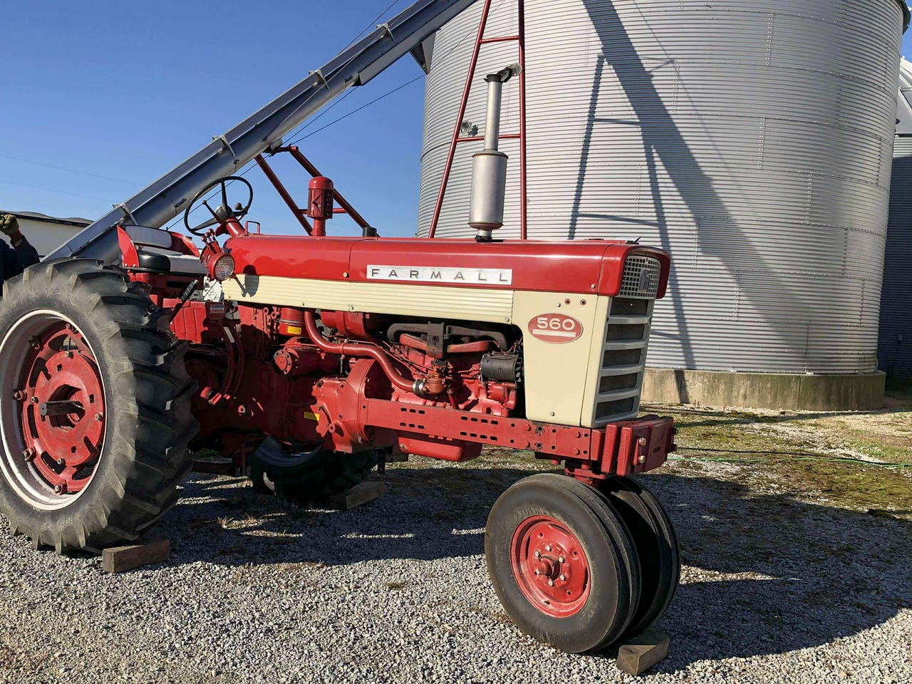 Farmer Raleigh Moore's dependable Farmall 656 continues elevating grain after half a century of service in Ida, Illinois