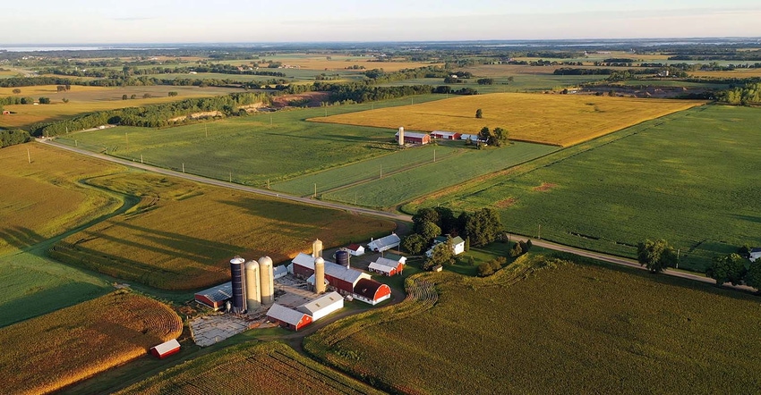 Aerial view of farm with red barns