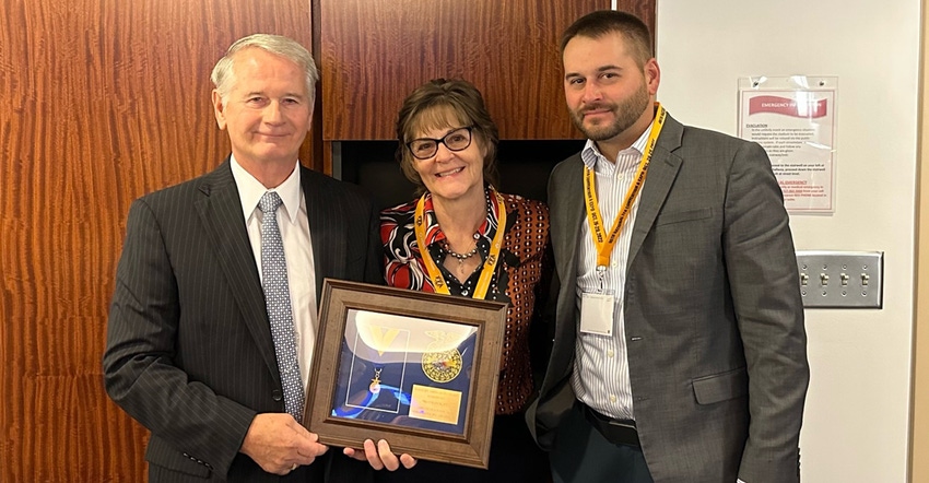 Troy Bancroft, left, AgroLiquid co-founder and board president, poses with wife Jill Bancroft and son Gerrit Bancroft