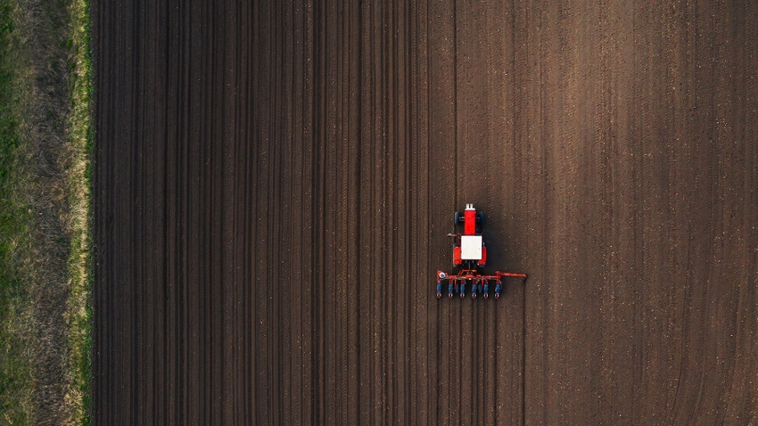 Aerial view of tractor planting corn
