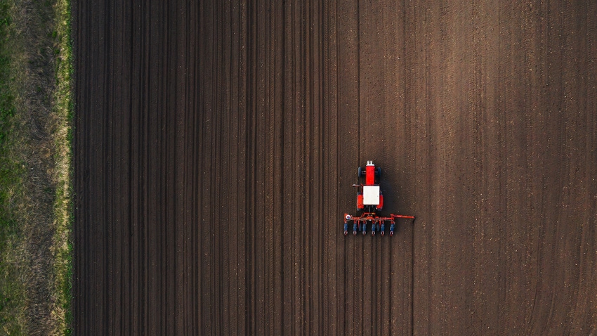 Aerial view of tractor planting corn Aerial view of tractor planting corn