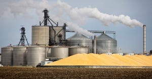 A ethanol plant and large pile of corn in the Midwest , U.S.A. 