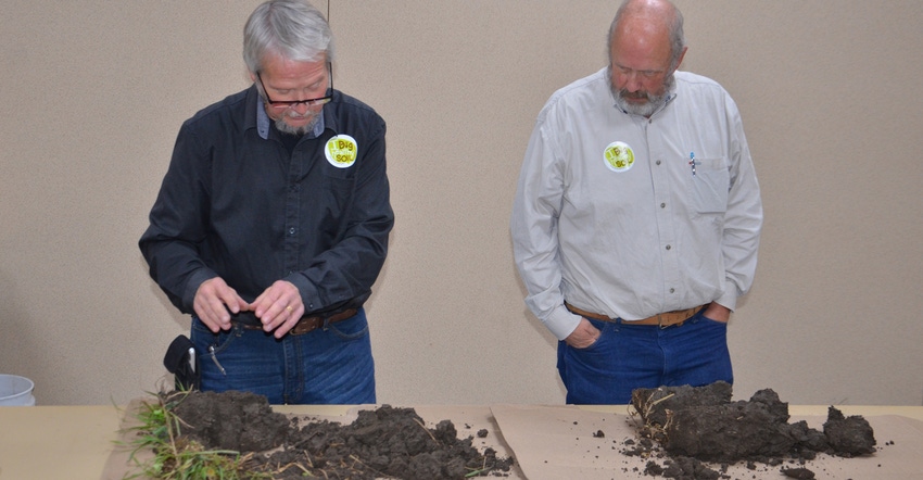 Brian Daggy and Curt Emanuel looking at soil samples