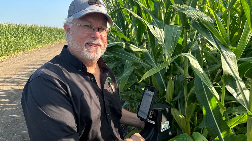  John Mascoe, founder and CEO of Leaftech Ag, stands next to corn