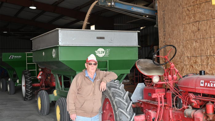 Kriesel standing next to tractor