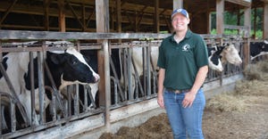 Sam Staebner in with dairy cow