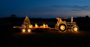 Tractor lit up with christmas lights