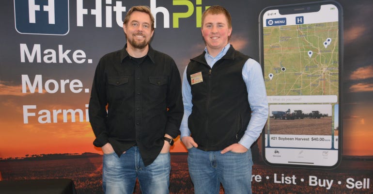 Trevor McKeeman, left and Kyle Riffel explained how HitchPin works to visitors at the 3i Show in March. 