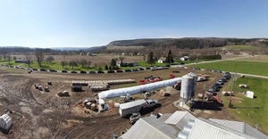 Aerial view of cars waiting for free dairy products at Taylor Pride Farms in Lawrenceville, Pa.