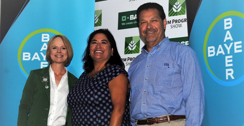 Jennifer Sirangelo, president of the National 4-H Council, left, Lisa Safarian of Bayer, center, and Mark Poeschl, CEO of the