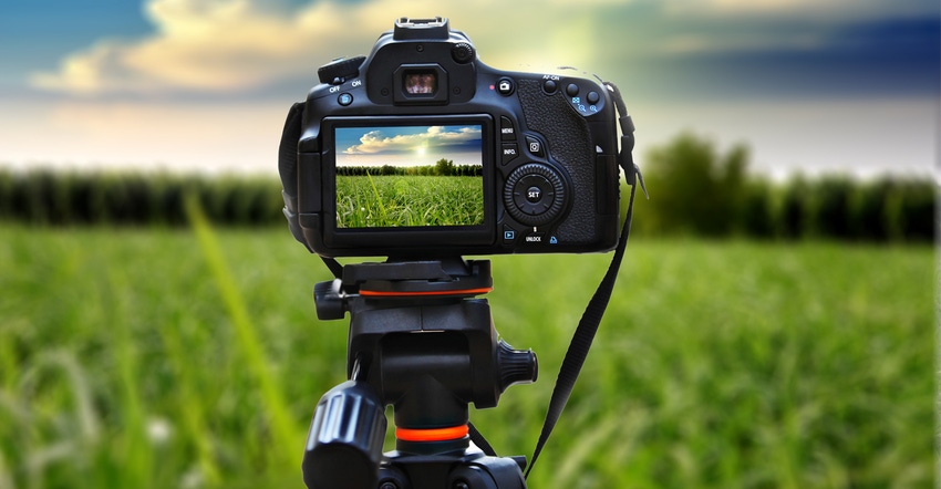 Camera taking a picture of farm field