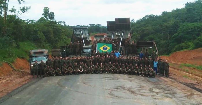 Brazilian engineer battalions celebrate the completion of paving operations of highway BR-163. 