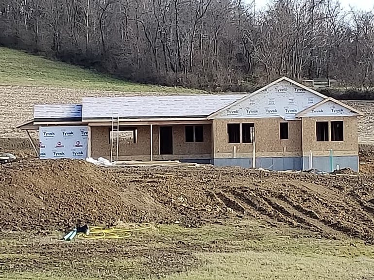 View of Mike and Sheilah Reskovac's new home with exposed exterior walls and new roof