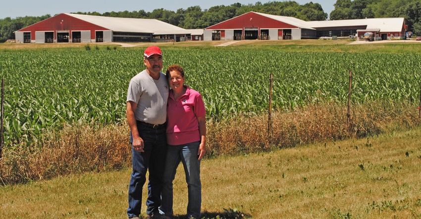 2021 Master Agriculturist Brian Brown is pictured with his wife Yogi at their 500-cow dairy farm near Belleville, Wis.