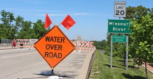 water over bridge signage on Missouri River