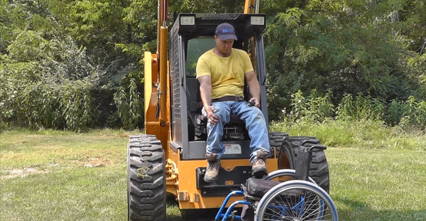 man transferring himself from wheelchair to seat in modified skid steer