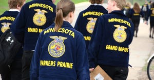 Group of FFA members walking in blue jackets