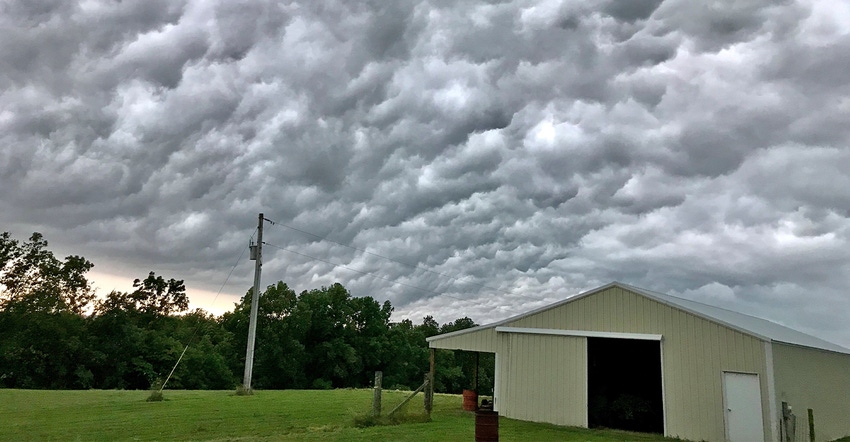 ominous storm clouds over rural shed