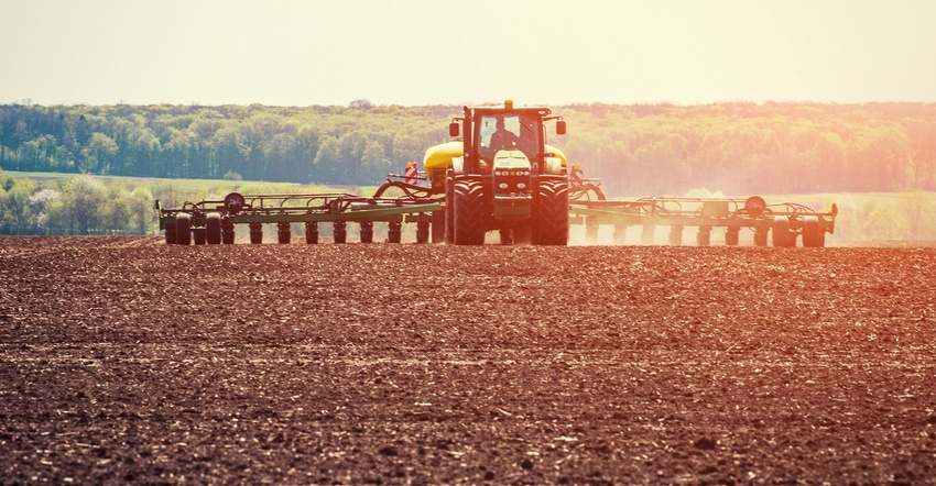 tractor plowing field