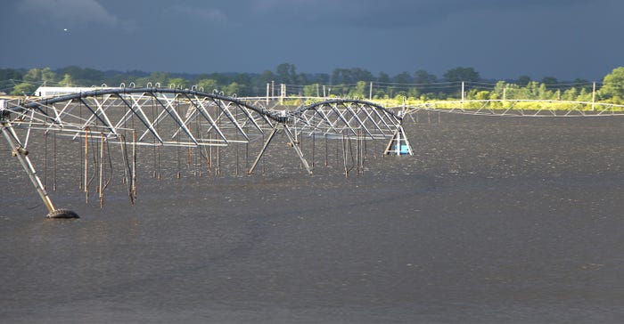 irrigation system sits idle in flooded field
