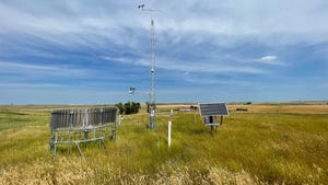 A weather station and solar panels in rural America