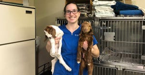 Dr. Jessica Glomb holding two young goats