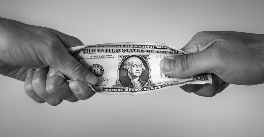 black and white image of two hands playing tug of war with a dollar bill