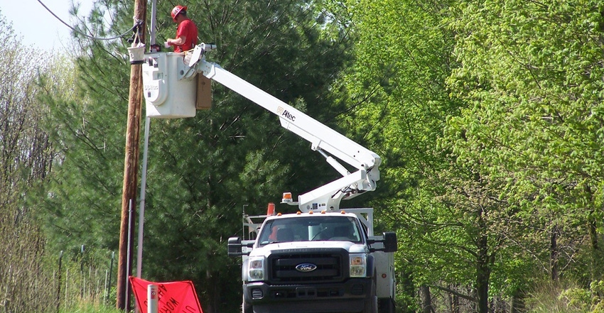 contractor working on telephone poll