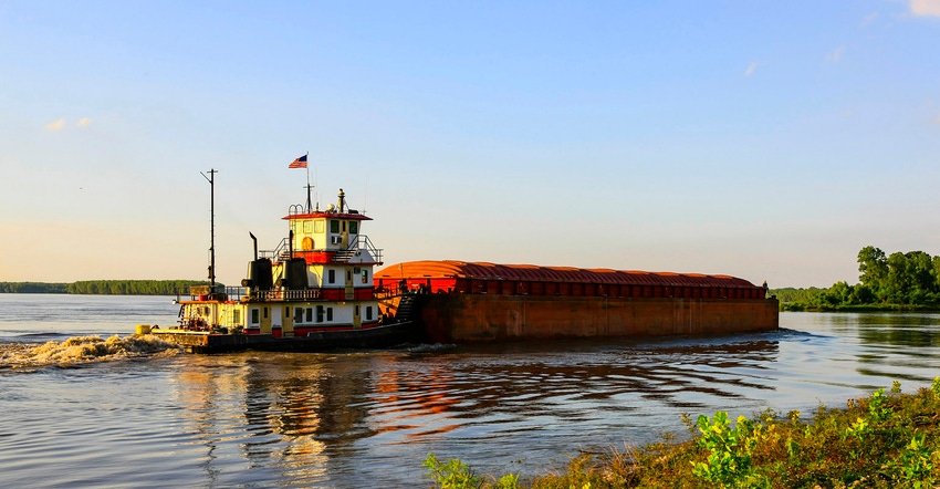 Tugboat pushing barges along the Mississippi River near Greenville, Mississippi.
