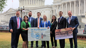 Lawmakers posing in front of U.S. capitol