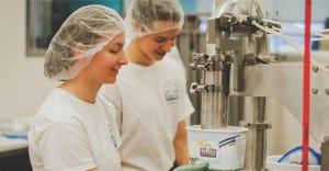 Claire Olson and Thijs Reuvekamp package ice cream at the Davis Dairy Plant 