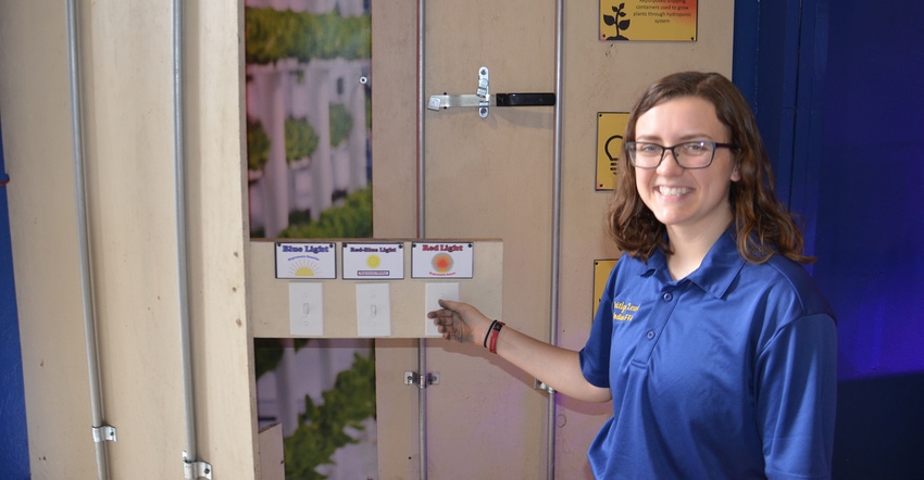 Caitlyn Lewis with container farming display