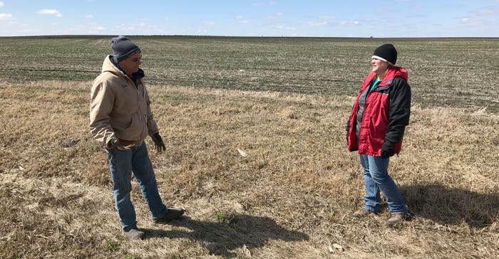 Tom Griebel and Laura DeBeer standing in a grassed waterway 