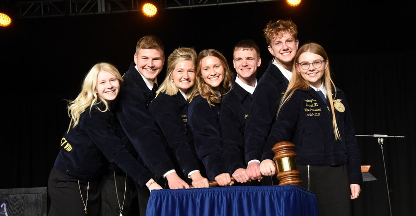2021-22 Indiana FFA state officers pose with large gavel