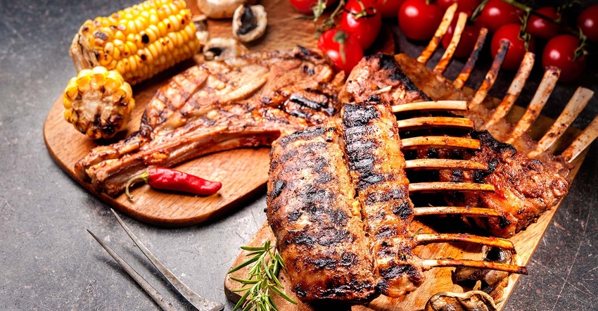 grilled rack of lamb on a cutting board